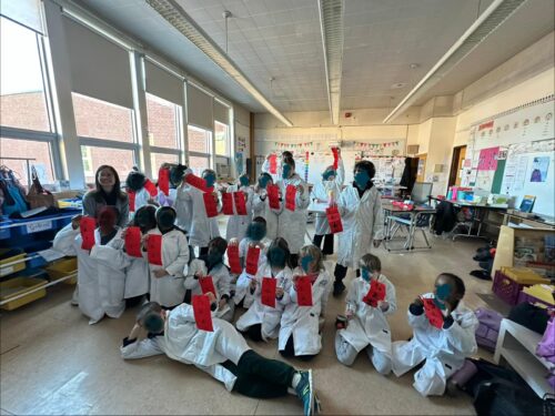 Student Chinese calligraphy artwork featuring the Year of the Horse blessing